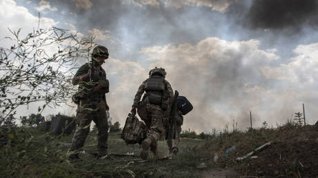 FILE PHOTO. Paratroopers from the 81st Airmobile Battalion come out from a trench after a attack from a BM-21 Grad multiple rocket launcher on July 5,2022 in Ukraine.