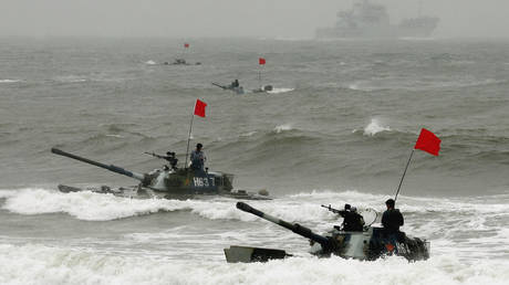 FILE PHOTO: Amphibious armored vehicles of the Chinese People's Liberation Army pictured during military drills.