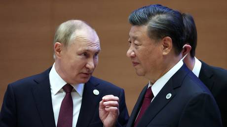 Russia’s President Vladimir Putin speaks to China’s President Xi Jinping during the Shanghai Cooperation Organisation (SCO) summit on September 16, 2022, Samarkand, Uzbekistan