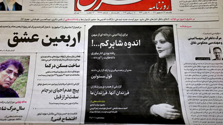 The front page of the Iranian newspaper Sharq featuring a photograph of Mahsa Amini.