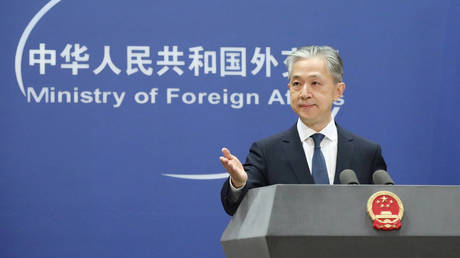 FILE PHOTO. Wang Wenbin attends a regular press conference.