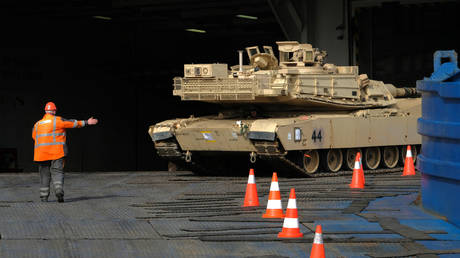 Military personnel unload a M-1 Abrams tank at the Port of Bremerhaven on February 21, 2020.