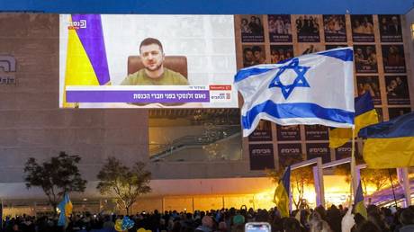 Israelis gather to watch a televised address by Vladimir Zelensky to the Israeli Knesset (parliament) in Tel Aviv, Israel, March 20, 2022
