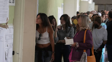 Voters at a polling station in Rome, September 25, 2022. © AP Photo / Gregorio Borgia