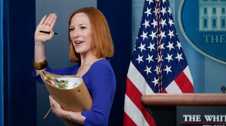 Jen Psaki is shown waving to reporters after her final White House press briefing on May 13.