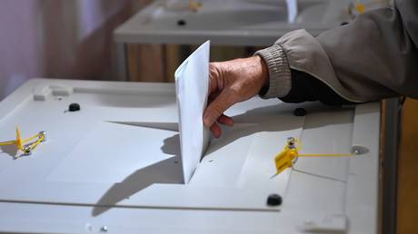 A man casts his ballot during the referendum on the joining Russia in Melitopol, Zaporozhye region.