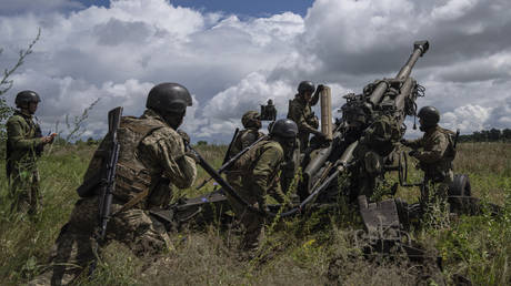 FILE PHOTO. Ukrainian soldiers target Russian positions from a US-supplied M777 howitzer in Kharkov Region, July 14, 2022.