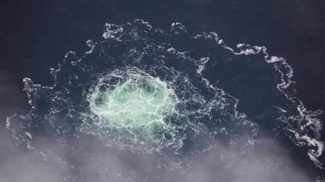 This handout photo taken on September 28, 2022 from an aircraft of the Swedish Coast Guard (Kustbevakningen) shows the release of gas emanating from a leak on the Nord Stream 2 gas pipeline, in the Swedish economic zone in the Baltic Sea.