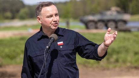 Polish President Andrzej Duda addresses troops taking part in NATO drills in Nowogrod.