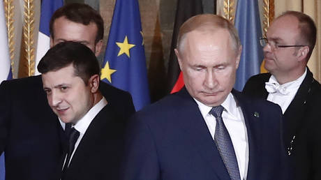 Vladimir Zelensky (R) and Vladimir Putin (R) arrive for a meeting at the Elysee Palace in Paris, France, December 9, 2019