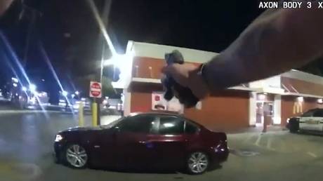 A San Antonio police officer fires his service pistol at a 17-year-old suspect as he attempted to flee, in San Antonio, Texas, October 2, 2022.