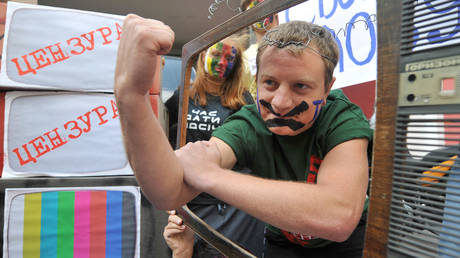 FILE PHOTO: An activist with his face painted takes part in protest against censorship in downtown Kiev.