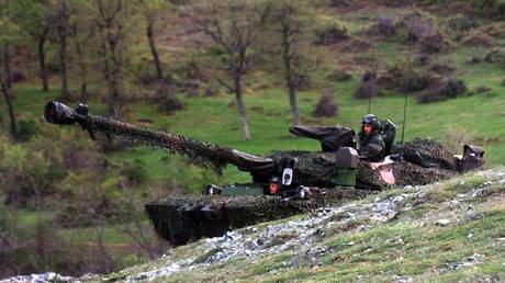 FILE PHOTO: French troops take up positions near the Serbian border in Macedonia, April 12, 1999