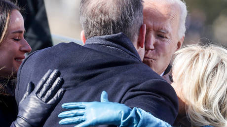 Joe Biden is shown kissing his son, Hunter Biden, after being sworn in as president in January 2021 in Washington.