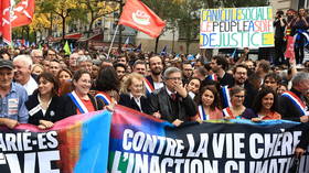Thousands march against economic misery in Paris