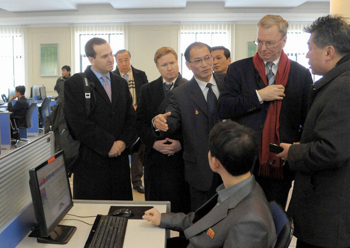 U.S. delegations including Google Executive Chairman Eric Schmidt (2nd R) look at a student using the Internet with desktop computers as he visits Kim Il-Sung University in Pyongyang, in this photo taken by Kyodo January 8, 2013. (Reuters/Kyodo)