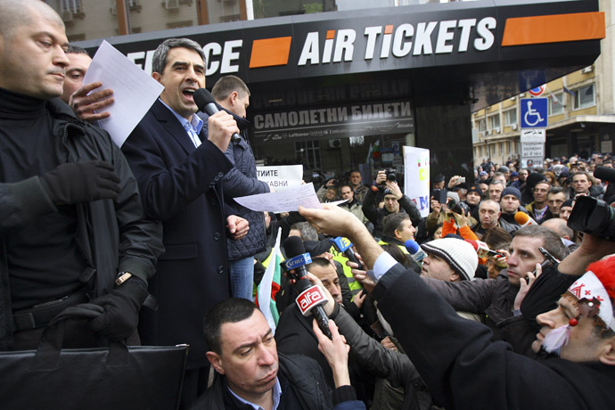 Bulgarian President Rosen Plevneliev (2nd L) addresses demonstrators during a protest against high utility bills and monopolies in the energy sector in Sofia February 24, 2013. (Reuters)