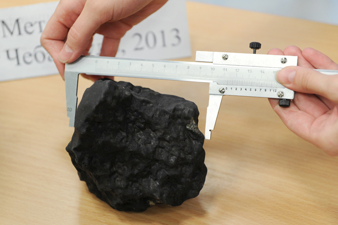 Fragment of the meteorite at the laboratory of the Research and Educational Center of Nanomaterials and Nanotechnologies of Ural Federal University. (RIA Novosti / Pavel Lysizin)