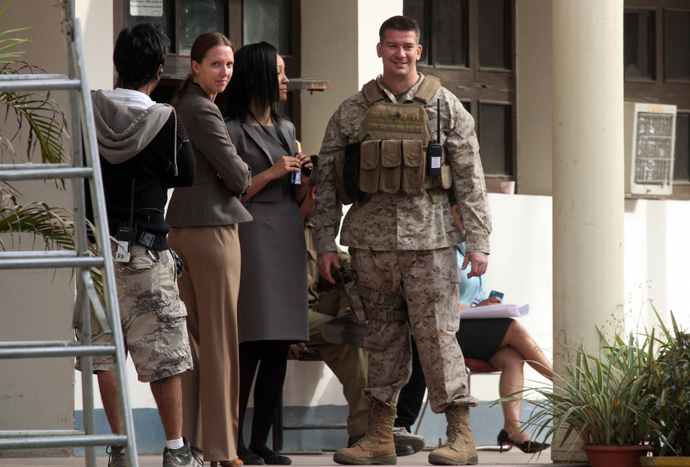 Unidentified cast and crew members are seen at the shooting site of the movie "Zero Dark Thirty" in the northern Indian city of Chandigarh March 6, 2012 (Reuters / Ajay Verma)