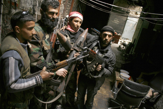 Members of the Free Syrian Army hold their weapons in the old city of Aleppo February 11, 2013. (Reuters/Zaid Rev)