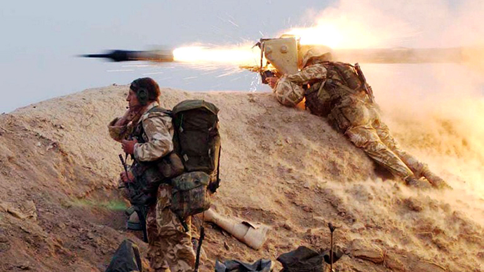 A photo issued 23 March 2003 of a British Royal Marine from 42 Commando squadron firing a Milan wire-guided missile at an Iraqi position on the Fao peninsula 21 March 2003. (AFP Photo / John Mills)