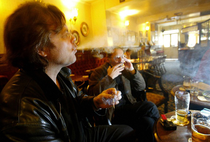 A smoker exhales in a pub in Richmond, London. (AFP Photo / Carl de Souza)