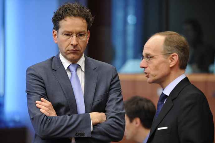 Dutch Finance Minister and Eurozone President Jeroen Dijsselbloem (left) talks with Luxembourg Finance Minister Luc Frieden prior to an Eurozone meeting on March 4, 2013 at the EU Headquarters in Brussels. (AFP Photo / Georges Gobet)
