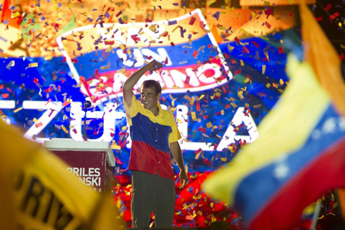 Venezuelan opposition presidential candidate Henrique Capriles reacts at the end of his closing campaign rally in Barquisimento, Lara state, Venezuela, on October 4, 2012. (AFP Photo / Eitan Abramovich)