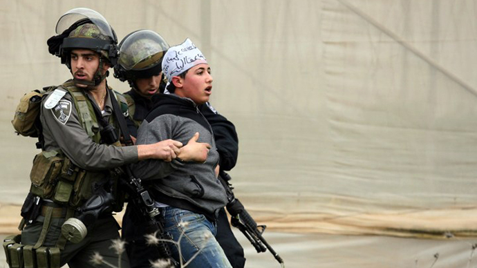 Israeli border police detain a Palestinian demonstrator following clashes at the entrance of the Jalama checkpoint, near the West Bank city of Jenin, on February 22, 2013. (AFP Photo / Saif Dahlah)