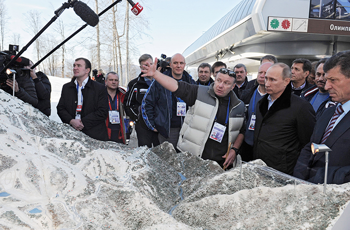 President Vladimir Putin, second right, being shown a model of the Olympic village, snowboarding park, Extreme freestyle center and the Rosa Khutor ski center on February 6, 2013. (RIA Novosti / Alexey Druginyn). ()