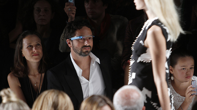 Google founder Sergey Brin and a guest watch the the Diane von Furstenberg Spring/Summer 2013 collection show during New York Fashion Week. (Reuters / Carlo Allegri)