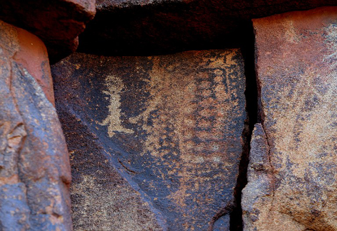 Ancient Aboriginal rock carvings are shown in this photo taken on the Burrup Peninsula in the north of Western Australia. (AFP Photo / Greg Wood)