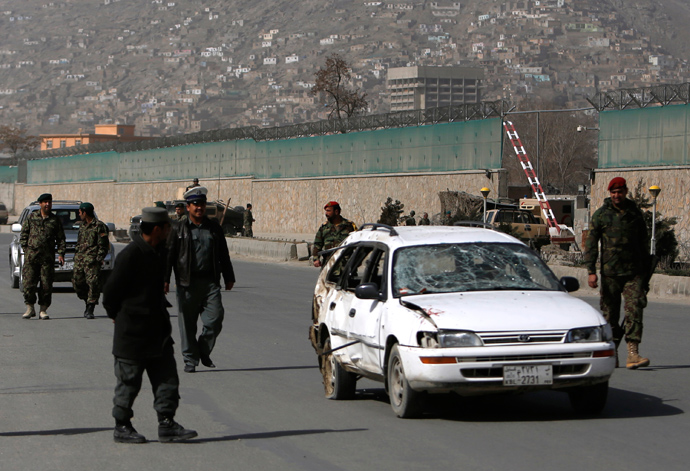 Afghan National Army soldiers remove a damaged car from the site of a suicide attack in Kabul March 9, 2013 (Reuters / Mohammad Ismail)
