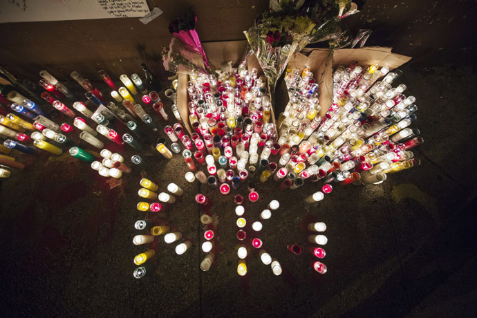 Candles stand lit on a street corner making up a memorial for 16-year-old Kimani "Kiki" Gray, after he was killed in a New York Police Department shooting in the Brooklyn borough of New York, March 11, 2013. (Reuters/Lucas Jackson)