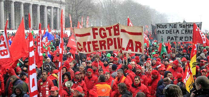 Workers and trade union representatives from all over Europe hold a demonstration against austerity near the European Commission and Council headquarters in Brussels March 14, 2013. (Reuters / Yves Herman)