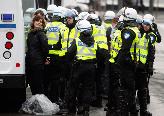 A demonstrator is arrested by police during the annual anti-police brutality march in Montreal, March 15, 2013.(Reuters / Christinne Muschi)