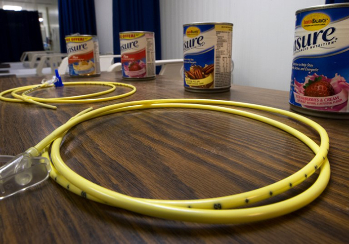 Two feeding tubes and cans of Ensure are seen inside the detainee hospital inside Camp Delta, part of the US Detention Center at Guantanamo Bay, Cuba. (AFP Photo / Paul J. Richards)