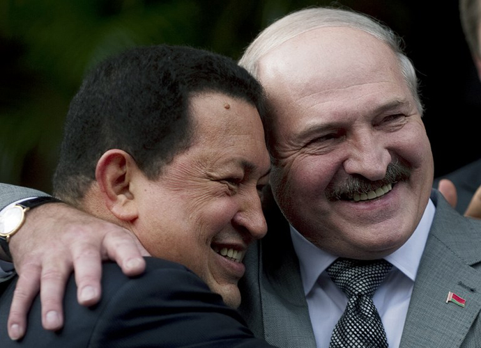 Venezuelan President Hugo Chavez hugs his Belarussian counterpart Alexander Lukashenko, during a meeting at Miraflores presidential palace in Caracas on June 26, 2012. (AFP Photo / Juan Barreto)