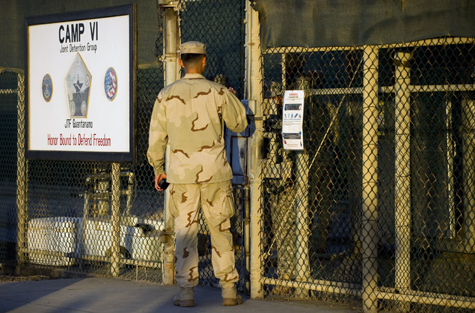 This image reviewed by the US military shows a member of the military asking for enterance at the front gate of "Camp Five" and "Camp Six" detention facility of the Joint Detention Group at the US Naval Station in Guantanamo Bay, Cuba, January 19, 2012. (AFP Photo)