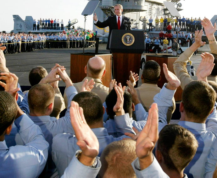 U.S. President George W. Bush addresses the nation and crew aboard the USS Abraham Lincoln while on an overnight visit to the aircraft carrier off the coast of California, May 1, 2003 (Reuters / Larry Downing)