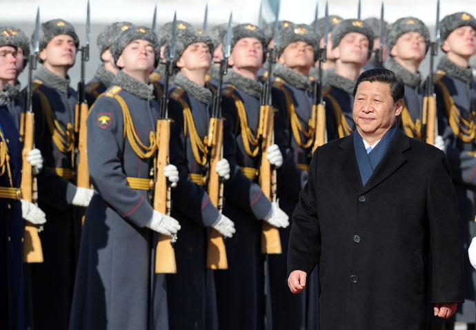 Chinese President Xi Jinping reviews Russian honour guard during official welcome ceremony at Vnukovo airport outside Moscow.(AFP Photo / Alexander Nemenov)