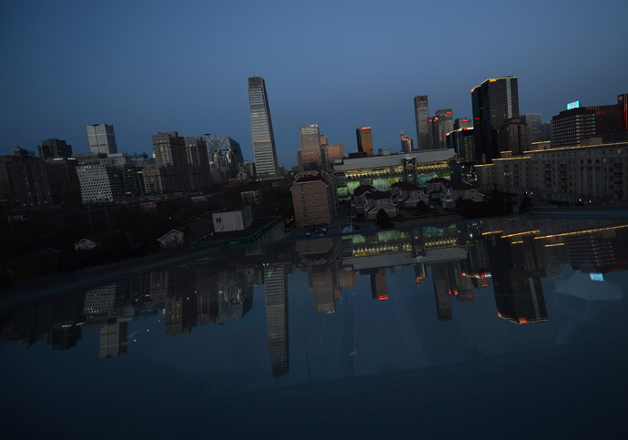 View of the Central Business District at sunset just before Earth Hour got underway in Beijing on March 23, 2013. (AFP Photo/Mark Ralston)