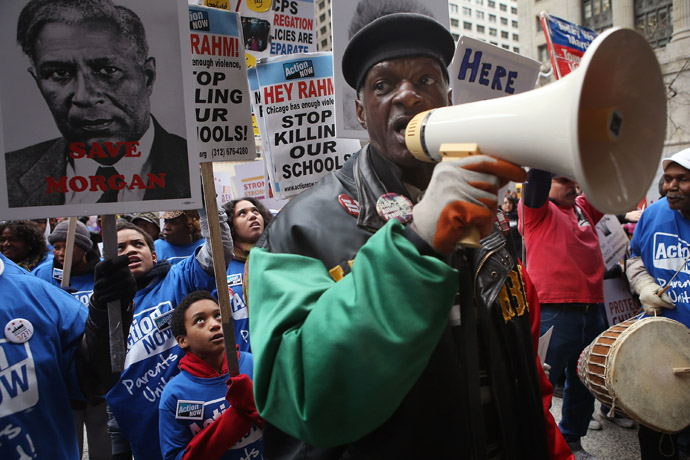 Scott rallies demonstrators protesting school closings on March 27, 2013 in Chicago, Illinois. More than 1,000 demonstrators held a rally and marched through downtown to protest a plan by the city to close more than 50 elementary schools, claiming it is necessary to rein in a looming $1 billion budget deficit. (Scott Olson/Getty Images/AFP)