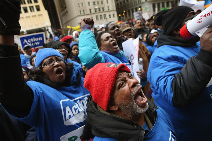 Demonstrators protest school closings on March 27, 2013 in Chicago, Illinois. More than 1,000 demonstrators held a rally and marched through downtown to protest a plan by the city to close more than 50 elementary schools, claiming it is necessary to rein in a looming $1 billion budget deficit. (Scott Olson/Getty Images/AFP)