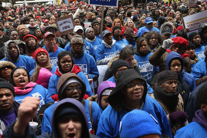 Demonstrators protest school closings on March 27, 2013 in Chicago, Illinois. More than 1,000 demonstrators held a rally and marched through downtown to protest a plan by the city to close more than 50 elementary schools, claiming it is necessary to rein in a looming $1 billion budget deficit. (Scott Olson/Getty Images/AFP)