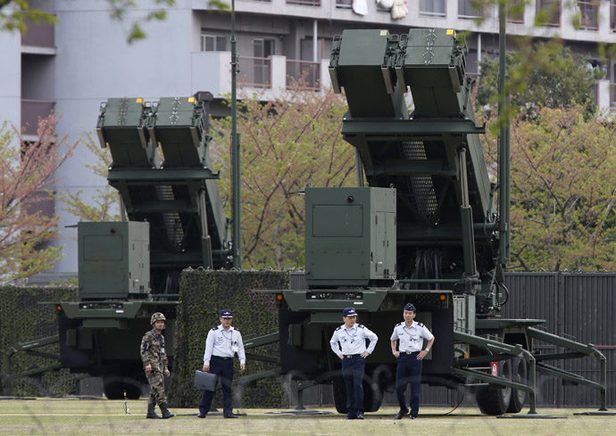 Japan Self-Defence Forces soldiers walk near Patriot Advanced Capability-3 (PAC-3) missiles at the Defence Ministry in Tokyo April 9, 2013. (Reuters)
