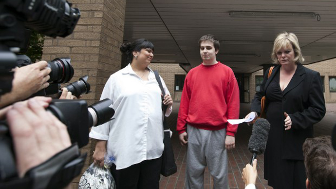 This file photo shows Ryan Cleary, a British teenager charged with attacking websites as part of the international hacking group Lulz Security, flanked by his mother Rita Cleary (L) and solicitor Karen Todner (R), leaves a London court. (AFP Photo / Warren Allott)