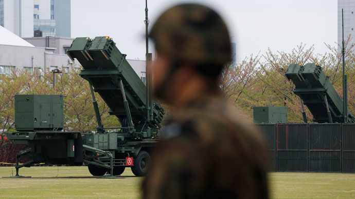 A Japan Self-Defence Forces soldier stands near units of Patriot Advanced Capability-3 (PAC-3) missiles at the Defence Ministry in Tokyo April 10, 2013. Japan has deployed ground-based PAC-3 interceptors, as well as Aegis radar-equipped destroyers carrying Standard Missile-3 (SM-3) interceptors in response to North Korea's threats and actions, according to its government.(Reuters / Issei Kato)