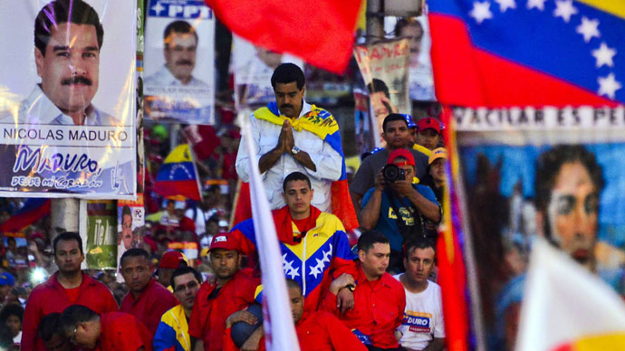 Venezuelan acting President and presidential candidate Nicolas Maduro gestures during his closing campaign rally in Caracas on April 11, 2013.(AFP Photo / Luis Acosta)