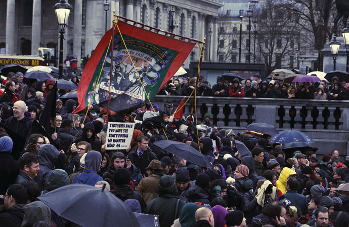 A banner representing the National Union of Mineworkers is carried through the crowd at a party to celebrate the death of the late former British prime minister Margaret Thatcher in central London April 13, 2013. (Reuters)